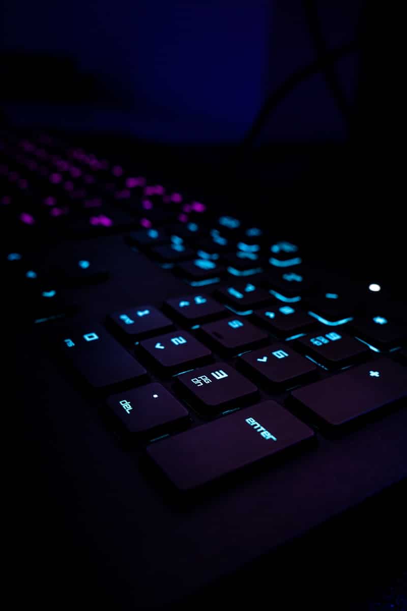 black computer keyboard on blue textile